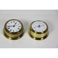 A small modern circular brass Wall Clock, and a similar matching Barometer. (2)