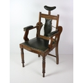 An Edwardian walnut Dentist's Chair, with leather back, seat and arms, and with brass and steel adju... 