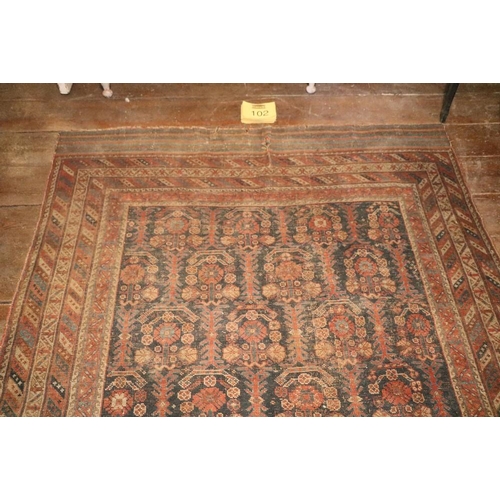 102 - A large antique Oriental Runner, with dark blue ground and multiple borders, approx. 353cms x 173cms... 