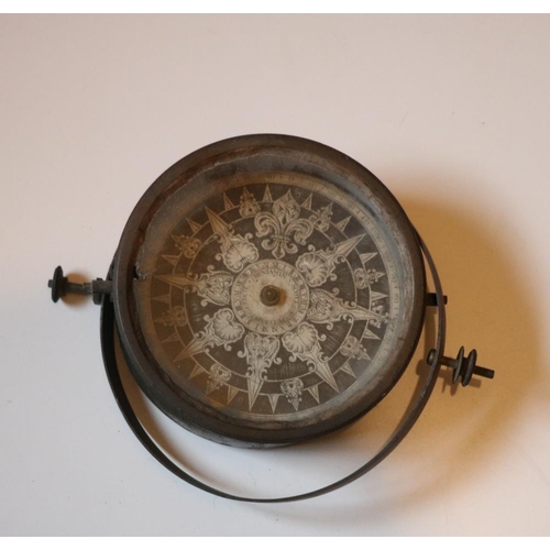 126 - A 19th Century Ship's Compass, with decorative engraved dial. (1)