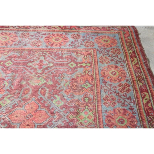 13 - An old red ground Carpet, with wide multiple borders, deep blue ground ditto, approx. 422cms x 341cm... 