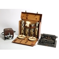 A Picnic Case, furnished with tea service etc., two portable Typewriters, two old Cameras, Record Ho... 