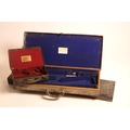 A good brass bound leather Gun-Case for a pair of shotguns, labelled 'H. Trulock Harris, London,' in... 