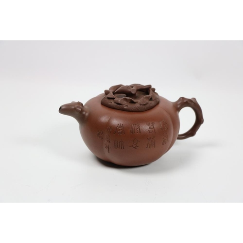 370 - A Chinese Yixing Teapot, of pumpkin form, incised with calligraphy and a landscape, a rustic form ha... 