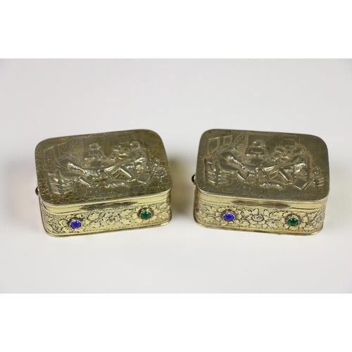 379 - A pair of heavy rectangular Continental silver gilt Table Snuff Boxes, each top with an interior sce... 