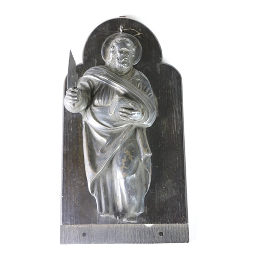 380 - An unusual 18th Century silver Dutch embossed wall mount of a Saint, with cleaver in one hand and bo... 