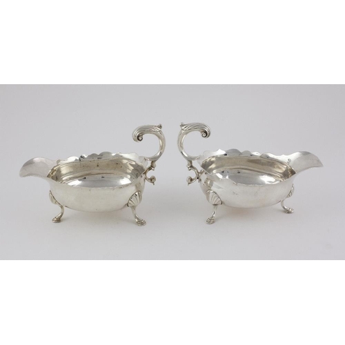 406 - A very good pair of early George III English silver Sauceboats, with serrated edge, scroll handles a... 