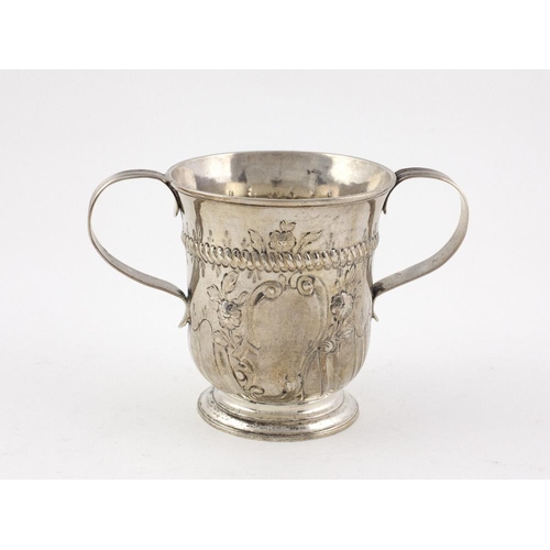 408 - An embossed English silver Porringer type two handled Bowl, the body with reeded decoration and embo... 