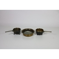 Two good heavy 19th Century bronze Skillet Pots, inscribed WH4 and 4PE, together with a large circul... 