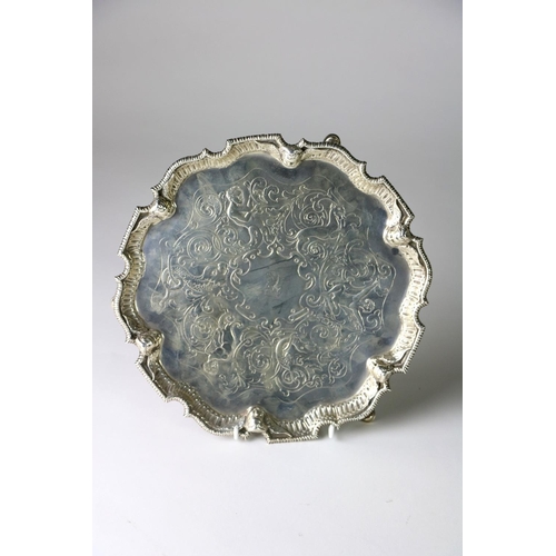 410 - An attractive engraved and embossed silver Salver, with etched design, the decorated rim with winged... 