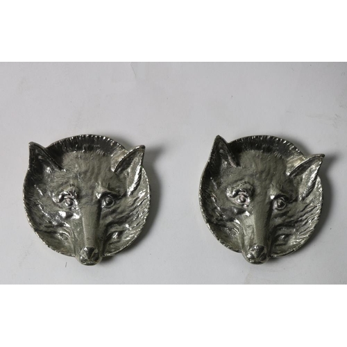 411 - A pair of silver plated fox head Ash Trays. (2)