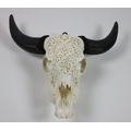 Taxidermy: A very unusual steer head Skull, wall mounted with two horns, the skull intricately carve... 