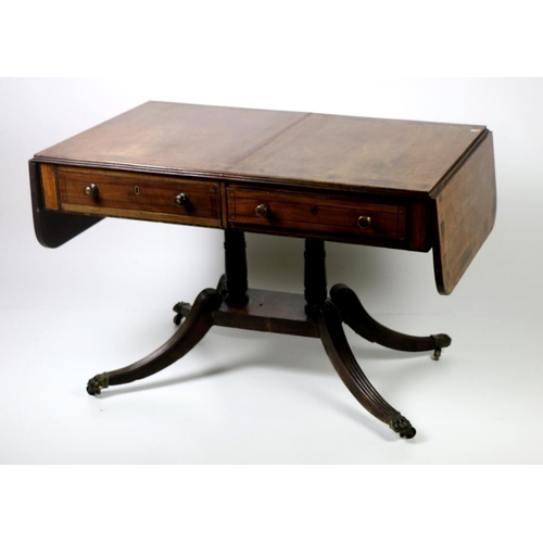 673 - A 19th Century mahogany Sofa Table, in the manner of Duncan Phyfe, the top with large crossbanded bo... 