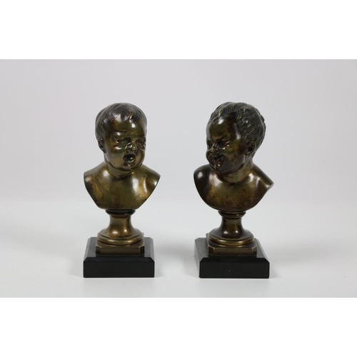 685 - A good pair of 19th Century French bronze Busts, a Smiling Infant and a Crying Infant, each on black... 