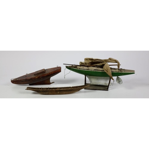 70 - Two wooden Model Boats, one with sails and a stand, and another item. A lot. (3)