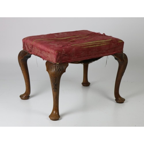 703 - A George II period mahogany framed Footstool, with padded top on cabriole pad feet, with carved stee... 