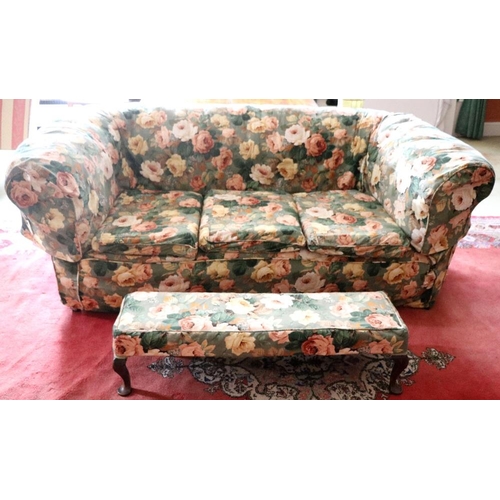 704 - A three seater Chesterfield type Settee, covered in floral green and cream ground fabric on square t... 