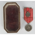 A rare Napoleon III silver Medal, after Barre with original miniature, and red striped ribbon, award... 