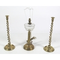 A pair of 19th tall Century brass barley twist Candlesticks, together with a brass OIl Lamp converte... 
