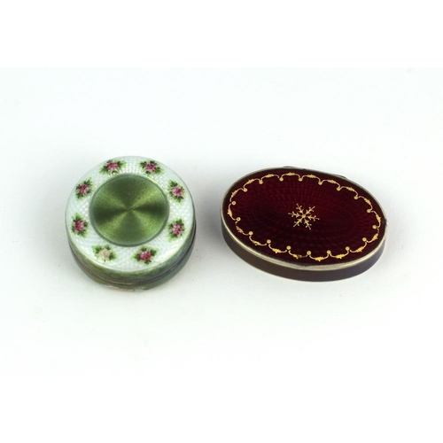 110 - A good quality small oval enamelled silver Pill Box, the rich crimson red ground with gold border an... 