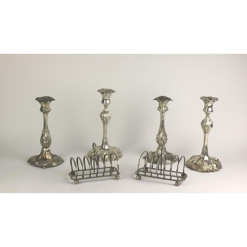 2 - Plateware: A box containing two pairs of plated Candlesticks, , two Toast Racks, silver plated Mugs,... 