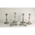 Plateware: A box containing two pairs of plated Candlesticks, , two Toast Racks, silver plated Mugs,... 