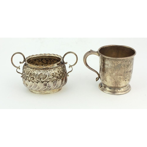 49 - A small Victorian English silver two handled Sugar Bowl, of oval shape with embossed and reeded body... 