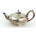 A heavy Victorian plain silver Teapot, of bulbous form, London c. 1879, possibly by J. Garrard, appr... 