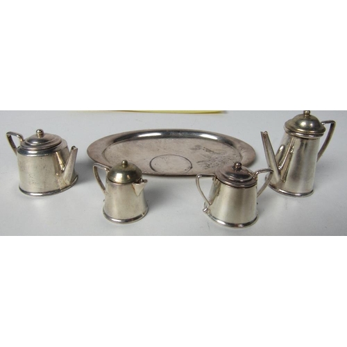 66 - A miniature Birmingham silver Tea Service, teapot, coffee pot, sugar and cream, all with lids, and a... 