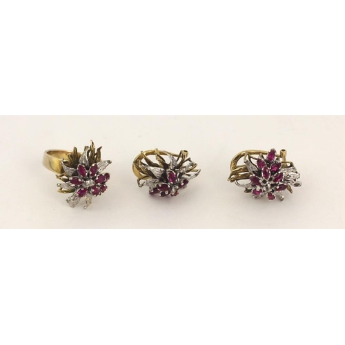 94 - A tiered cluster 18ct gold Dress Ring, in two tone floral spray motif set with 9 marquise shaped 'ru... 