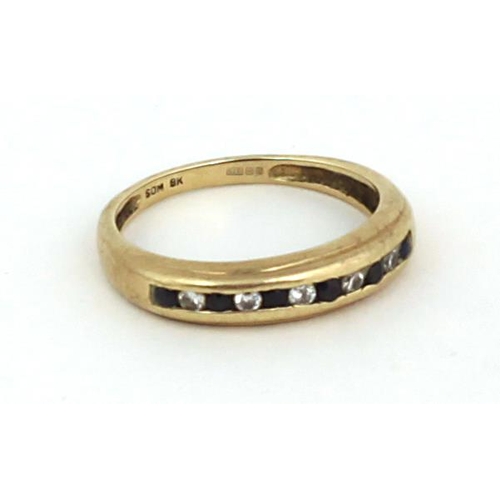 97 - A 9ct gold Ring, with inset single row of sapphire and white stones. (1)