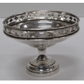 A late Victorian pierced silver Tazzi, the pierced and decorated rim on a tumbler and stepped base, ... 