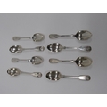 A set of 8 Edwardian shell decorated and crested Dessert Spoons, by Robert Stebbings, London, approx... 