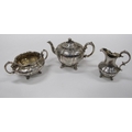 A fine quality Victorian three piece chased decorated Tea Set, comprising teapot, cream jug and suga... 