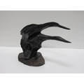An unusual bog oak Statue, depicting two swans resting on a naturalistic base, approx. 40cms (16