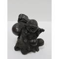 A heavy 19th Century Japanese bronze Figure of rotund Japanese Man, Hotri, seated with a backpack, 1... 