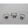 An attractive 14k white gold Ring, set with a floral design amethyst stone, together with platinum s... 