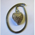 A rare and attractive 18ct. gold (23.6g tw) heart shaped Pendant, in both yellow and white gold, wit... 