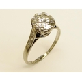 An elegant and desirable 8 claw Rex setting Pave set Ring, with a central round brilliant 2ct, G/VS2... 