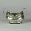 An Irish Georgian silver boat shaped Sugar Bowl, Dublin c. 1825, with two handles and engraved decor... 