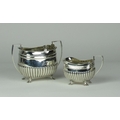 A matched silver Sugar Bowl & Cream Jug, the bowl Birmingham c. 1894, the jug by Mappin & Webb, Shef... 