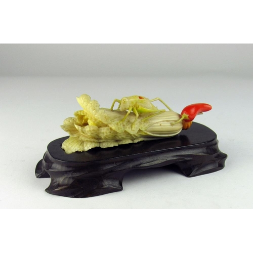 101 - A very fine carved Meiji period Japanese ivory Okimono of a locust perched on a head of celery, with... 