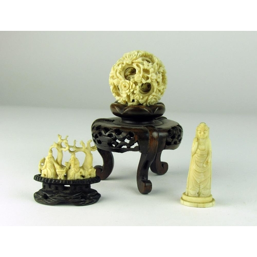 102 - A 19th Century Chinese carved ivory Puzzle Ball, on contemporary pierced wooden stand; a small Orien... 