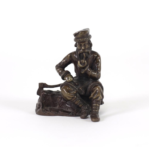 113 - 20th Century Russian SchoolA small bronze Figure of a bearded Gentleman seated in winter attire smok... 