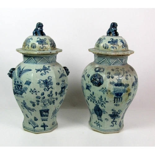 124 - A pair of 18th Century style blue and white Chinese large octagonal Pots & Covers, decorated in the ... 