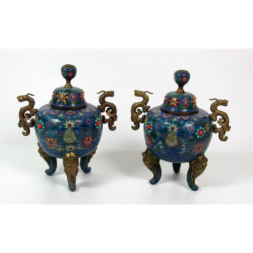 125 - A pair of attractive 19th Century Chinese cloisonn and brass mounted tripod Urns with covers, the o... 