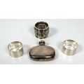 A pair of plain Birmingham silver Napkin Rings, engraved 'G' & 'J', another silver decorated and emb... 