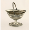 A good late George III Irish silver Sugar Helmet, with ribbed swing handle, the oval body decorated ... 