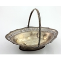 A large and very attractive English silver Fruit Basket, with pierced and engraved shaped rim, and r... 