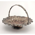 A very ornate English silver Fruit Basket, with swing handle, and engraved and embossed decoration, ... 